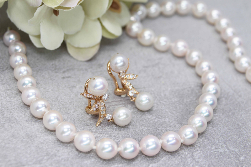round pearl necklace and earrings